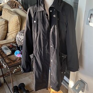 Weatherproof Anorak raincoat. Cinched waist ties pocket ties. Black and lined.